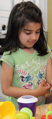 Pupil at desk choosing a drink