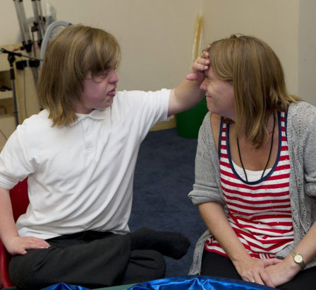 A teacher and two young boys
play a classroom game
