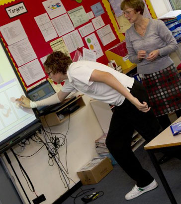 Boy presenting in front of class