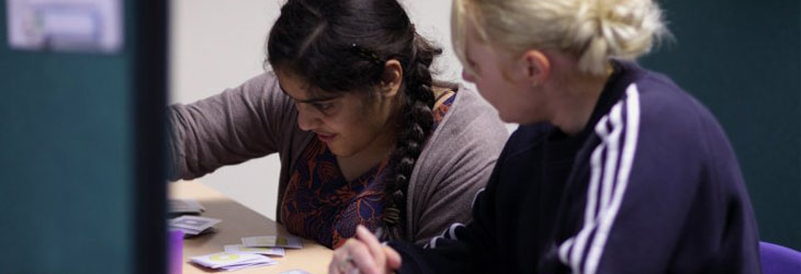 A teacher and a girl with a small model
                  of an elephant