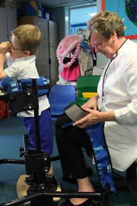 Nurse helping child.