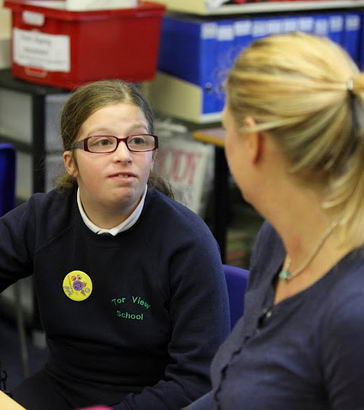 A girl and a teacher talk