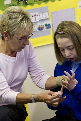 Teacher interacting with a girl