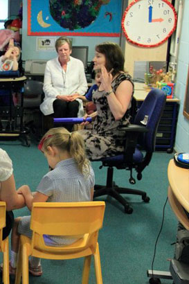 Two teacher looking at a lesson plan