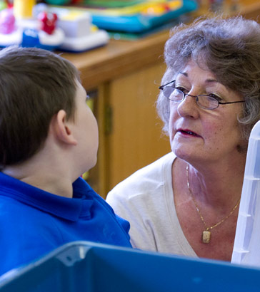 Teacher interacting with a child