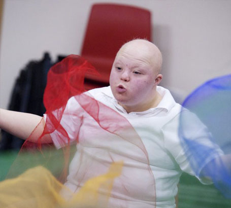 Boy throwing a net in front of
his face
