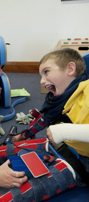 Boy looking at his hand.