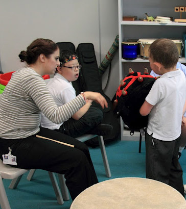 Teacher interacting with children