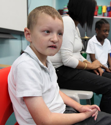 Boy sitting on a chair