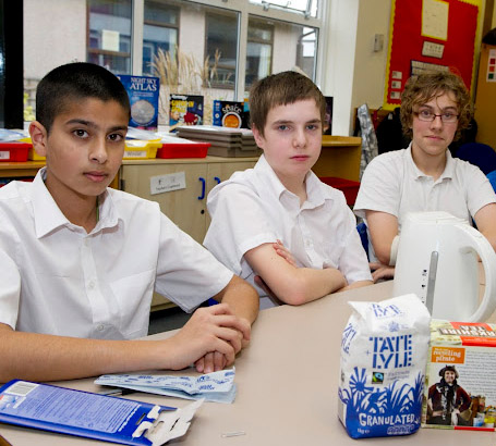 Three pupils sitting at a table