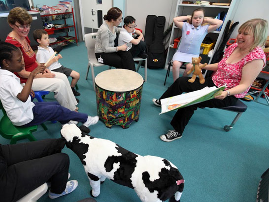 group of teachers and students seated around
                  range of objects