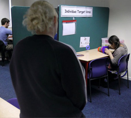 staff reviewing documents at meeting