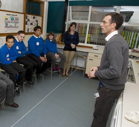 A male teacher disseminates findings
                  to his class