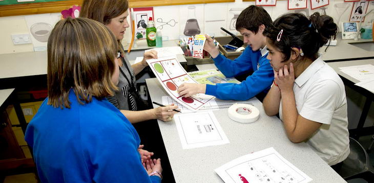 A female students sits with her
                  students